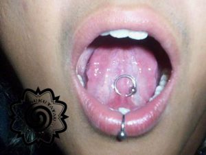 tongue piercing - lip piercing