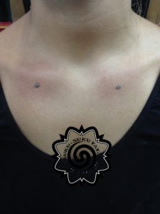 woman body piercing - dermal piercing - suku suku tatau