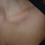 woman body piercing - dermal piercing - suku suku tatau