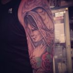 woman with rose tattoo - suku suku tatau